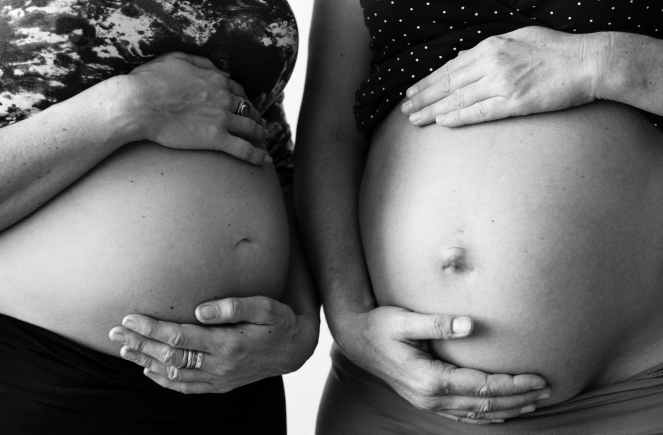 grayscale photo of two pregnant women